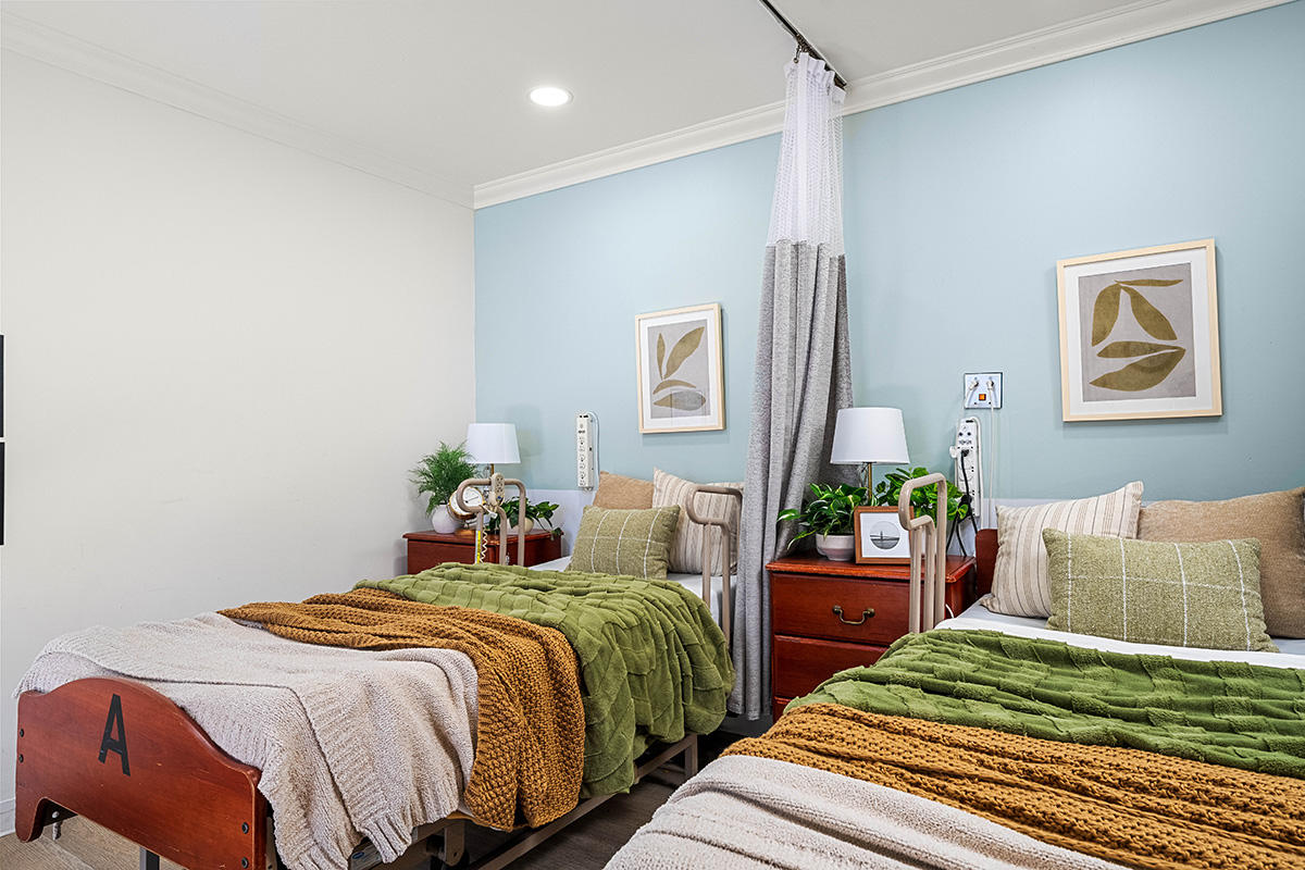Cozy shared bedroom with two beds and decorative accents.