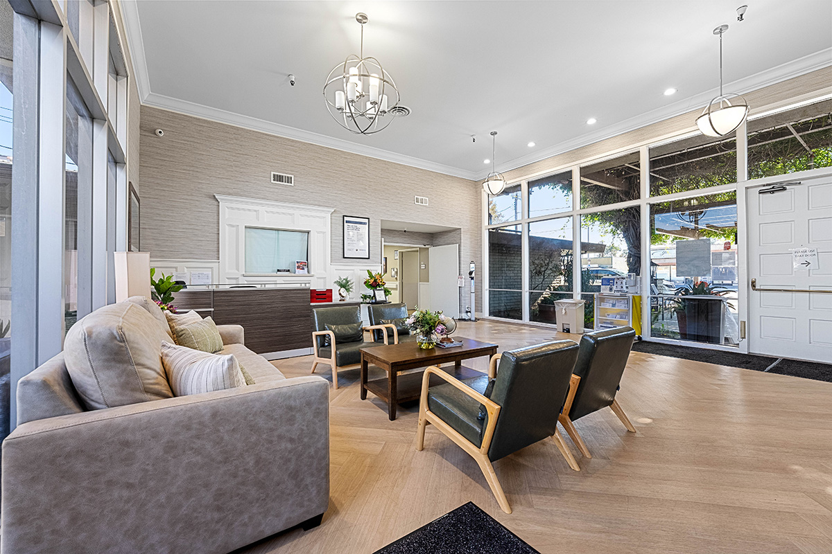 Modern waiting area with comfortable seating and large windows.